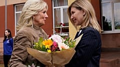 First lady Jill Biden greets Ukraine's first lady Olena Zelenskyy, outside a public school Uzhhorod, Ukraine, Sunday, May 8, 2022.