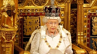 Britain's Queen Elizabeth II reads the Queen's Speech from the throne during the State Opening of Parliament in the House of Lords in London, Wednesday, May, 18, 2016. 