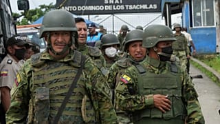 Soldiers guard outside Bellavista prison where a deadly riot broke out overnight in Santo Domingo de los Tsachilas, Ecuador, Monday, May 9, 2022. 
