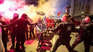 Demonstrators take part in a rally against the curfews and coronavirus restrictions in Frankfurt/Main, Germany, Saturday, April 24, 2021.