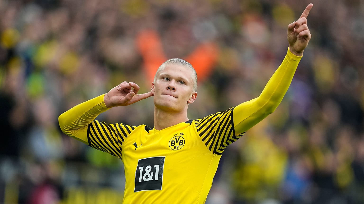Dortmund's Erling Haaland celebrates after scoring a penalty during the German Bundesliga soccer match between Borussia Dortmund and FSV Mainz 05 in Dortmund