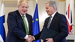 British Prime Minister Boris Johnson, left, and Finland's President Sauli Niinistö shake hands at the Presidential Palace in Helsinki, Finland, Wednesday, May 11, 2022. 