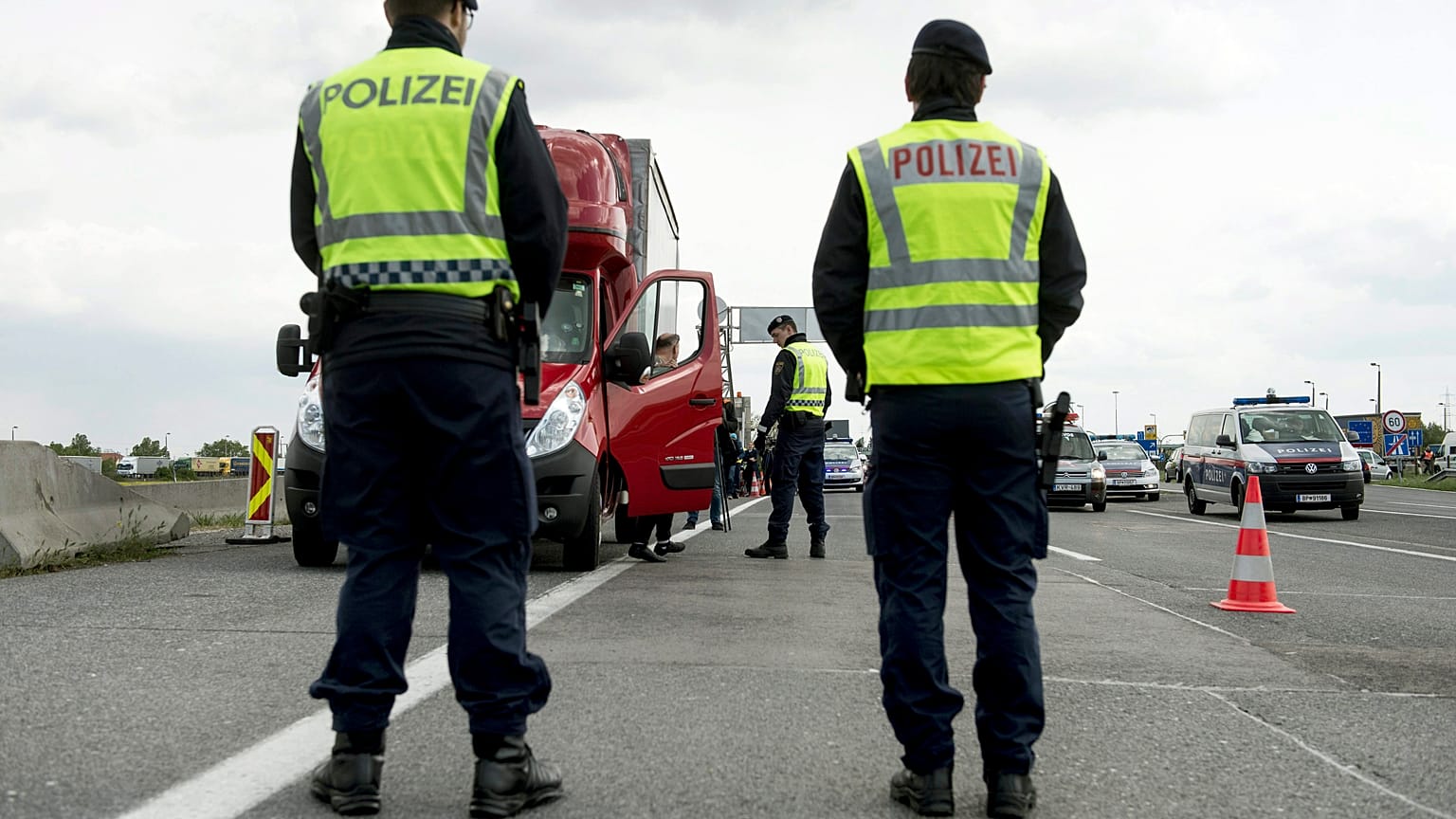 Austrian policemen check vehicles at the Hungarian border near Nickelsdorf.