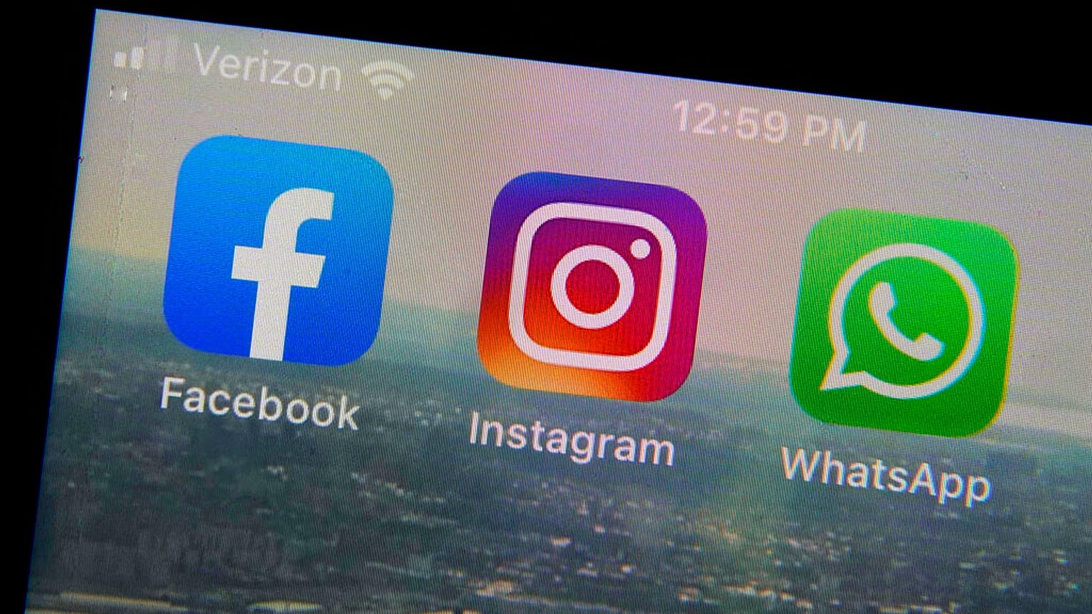  Mobile phone app logos for, from left, Facebook, Instagram and WhatsApp