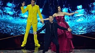 Hosts of the Eurovision Song Contest Laura Pausini, right, stands on stage with Mika, left, and Alessandro Cattelan during the second semi final at the Eurovision Song Contest