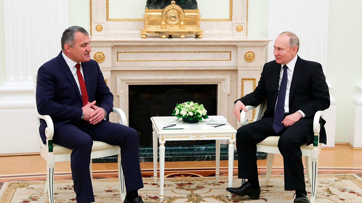 Russian President Vladimir Putin, right, listens to Leonid Bibilov, the leader of Georgia's breakaway region of South Ossetia, Moscow, March 13, 2020. 
