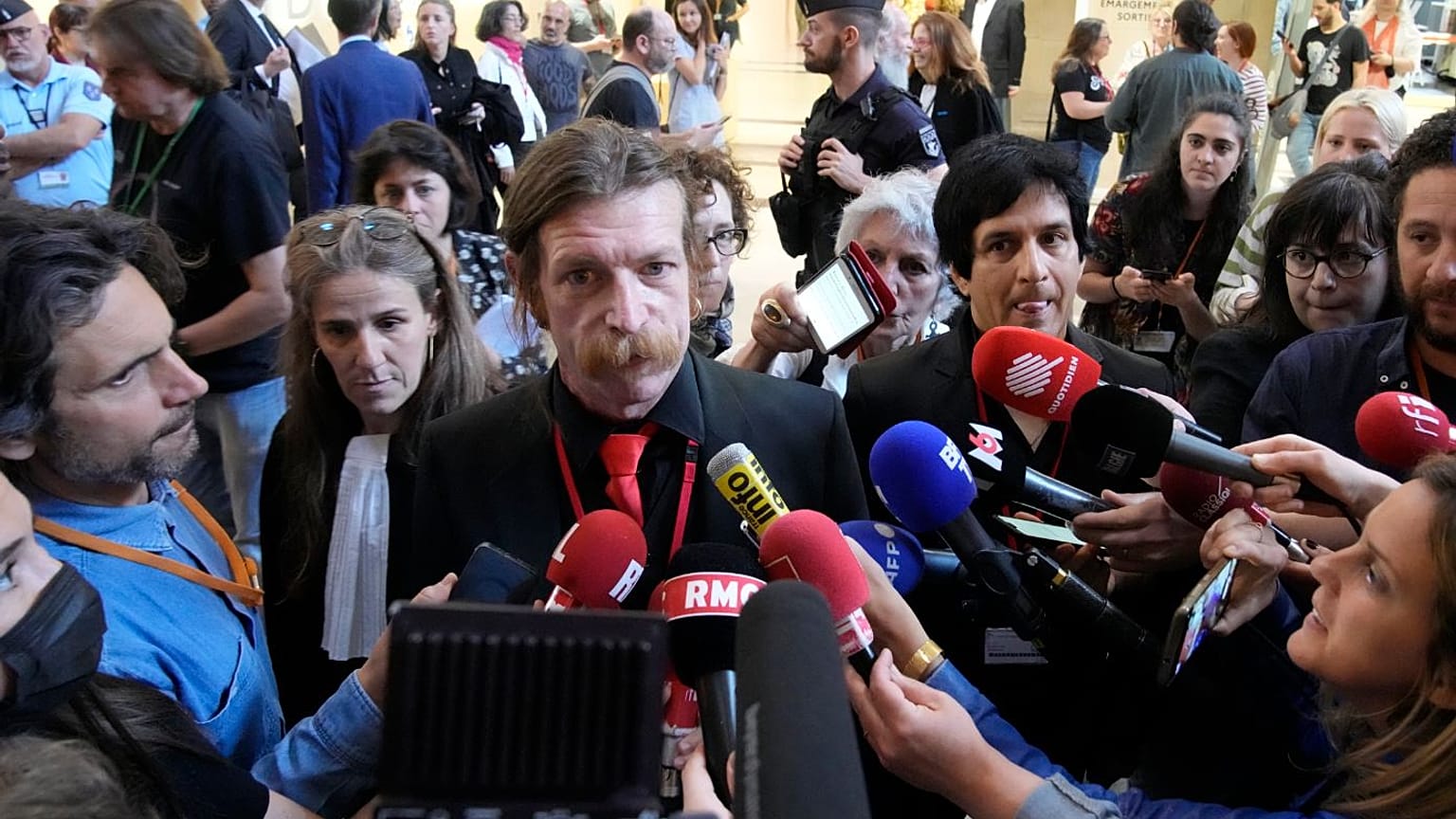 Eagles of Death Metal singer Jesse Hughes and guitarist Eden Galindo spoke to reporters on Tuesday.