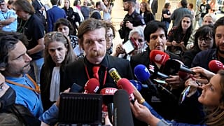 Eagles of Death Metal singer Jesse Hughes and guitarist Eden Galindo spoke to reporters on Tuesday.