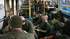 Ukrainian servicemen sit in a bus after they were evacuated from the besieged Mariupol's Azovstal steel plant. Tuesday, May 17, 2022.