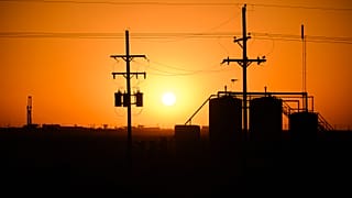 An oil rig in Texas: Existing fossil fuel extraction must end early to stop climate change say experts