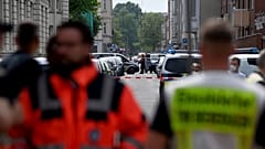 Police and emergency forces stand near a school in Bremerhaven, Germany, Thursday, May 19, 2022.