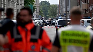 Police and emergency forces stand near a school in Bremerhaven, Germany, Thursday, May 19, 2022.