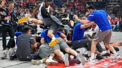 Anadolu Efes' players celebrate at the end of a Final Four Euroleague semifinal basketball match between Olympiacos and Anadolu Efes, in Belgrade.