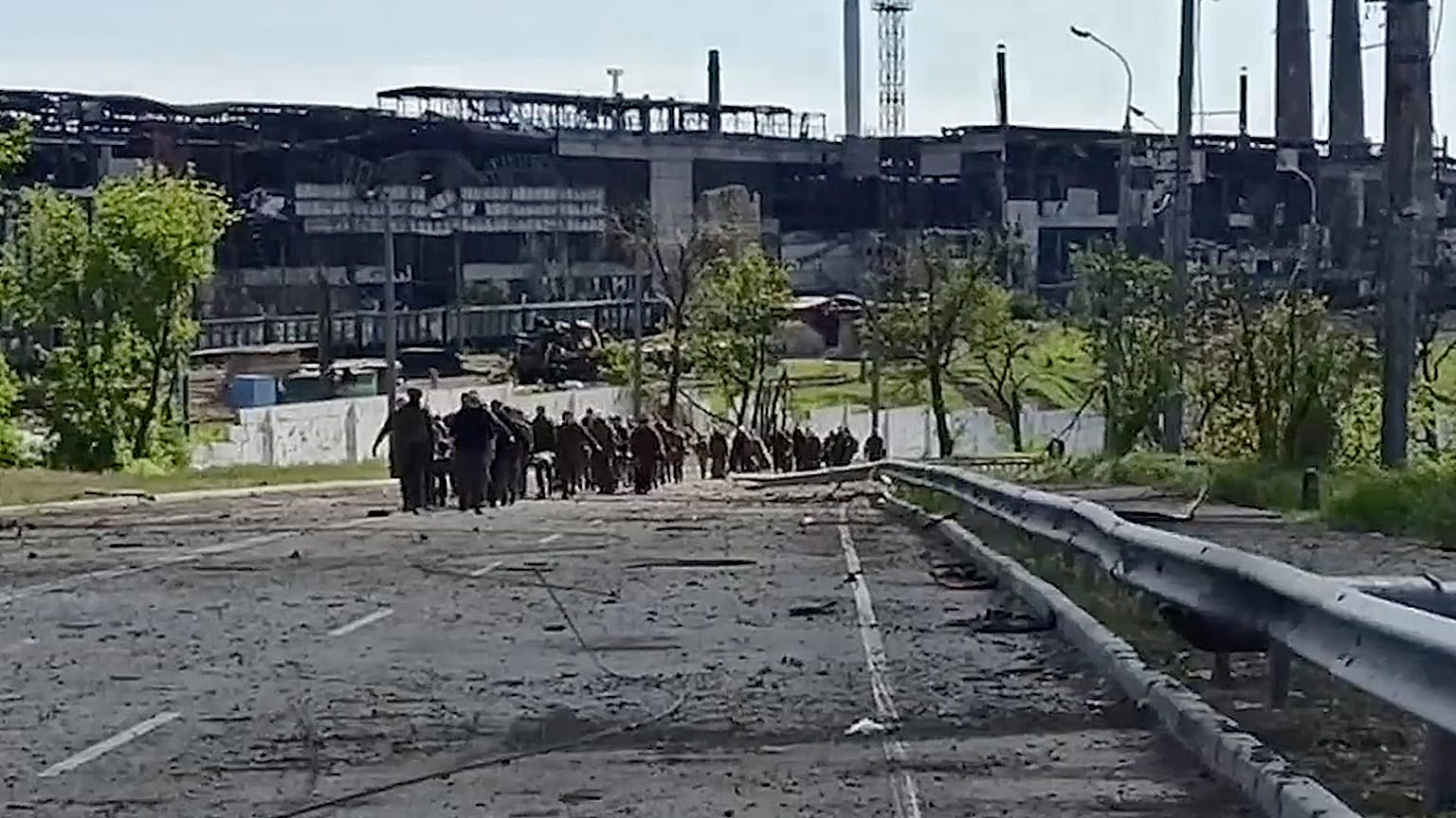 Ukrainian servicemen leave the besieged Azovstal steel plant in Mariupol, Ukraine, seen in a video from Russia's defence ministry released on May 18, 2022.