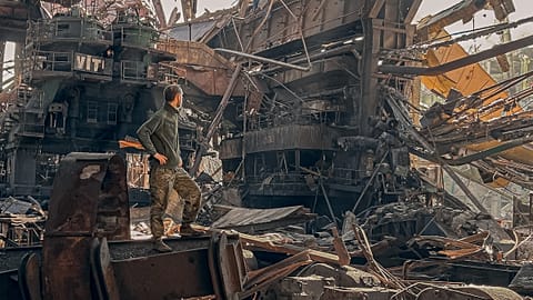 A soldier of Azov regiment stands on the ruins of the Azovstal steel plant during its siege. May 2022