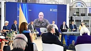 Denys Shmyhal, Ukraine's prime minister, is seen on a video screen during a G7 Finance Ministers Meeting