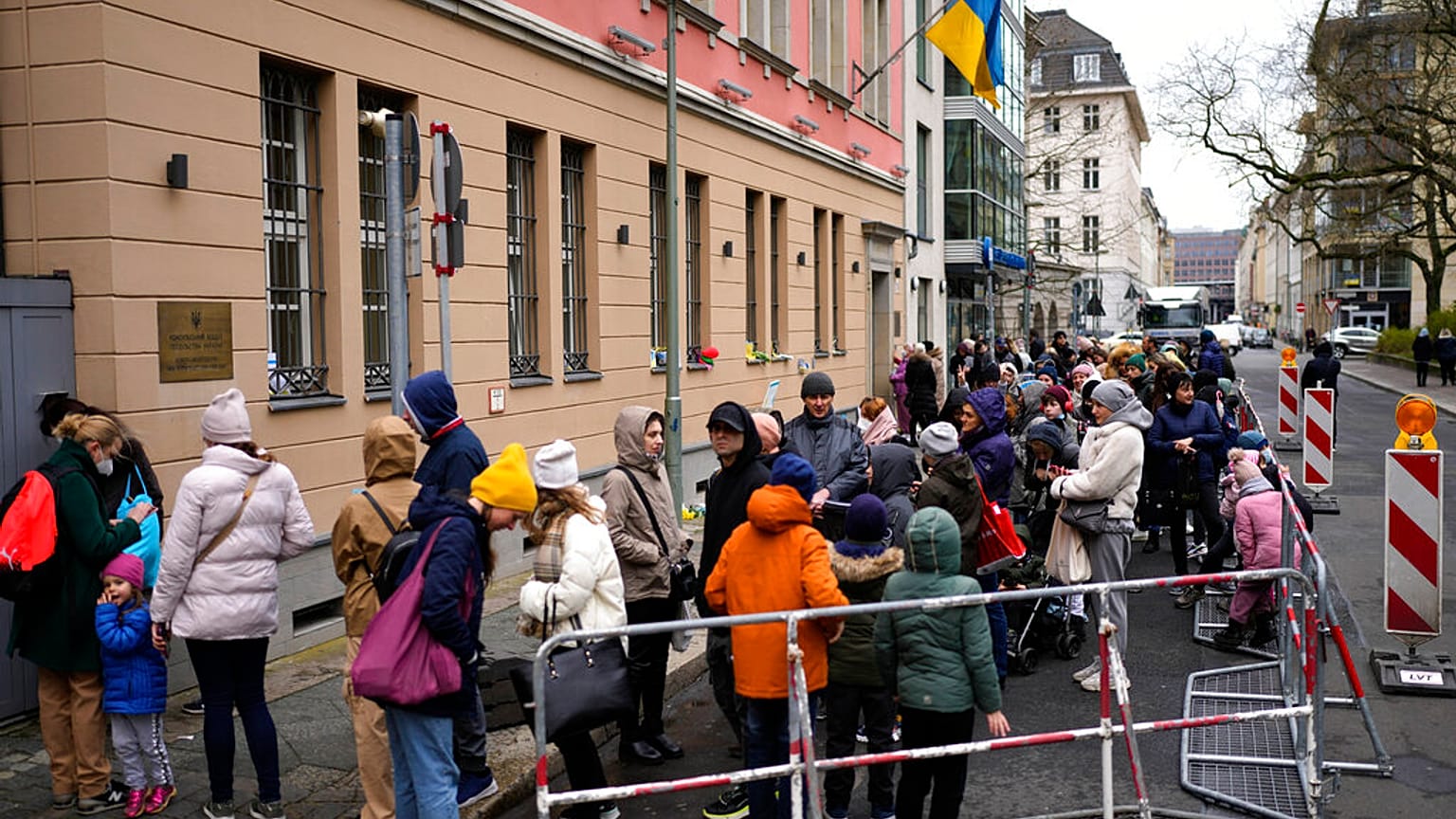 People from the Ukraine most of them refugees fleeing the war, wait in front of the consular department of the Ukrainian embassy in Berlin, Germany, Wednesday, April 6, 2022