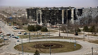 Damage is seen on apartment buildings after shelling from fighting on the outskirts of Mariupol in late March 2022