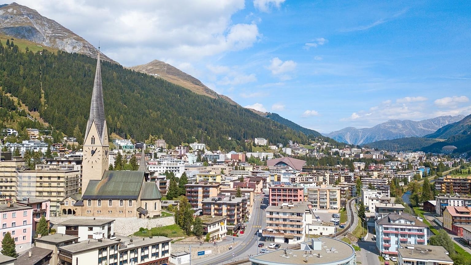 Attendees of the World Economic Forum in Davos are greeted by sunshine and green landscapes instead of snow this year.