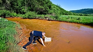 River in Slovakia turns orange as scientists warn of an ecological disaster.