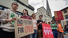 Young protesters take part in a demonstration against the World Economic Forum (WEF)