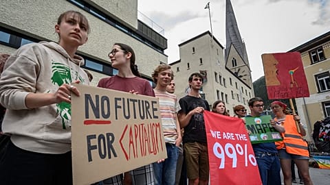 Young protesters take part in a demonstration against the World Economic Forum (WEF)