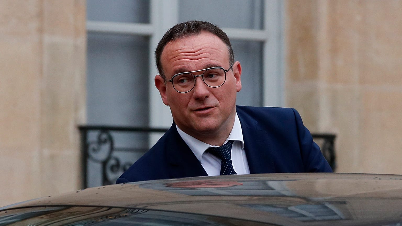 New French Minister of Solidarity Damien Abad leaves the Elysee Palace on Monday.