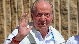 uan Carlos waves before a reception at a nautical club in Sanxenxo on Friday.