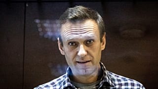  Russian opposition leader Alexei Navalny looks at photographers standing in the Babuskinsky District Court in Moscow, Russia, Saturday, Feb. 20, 2021. FILE