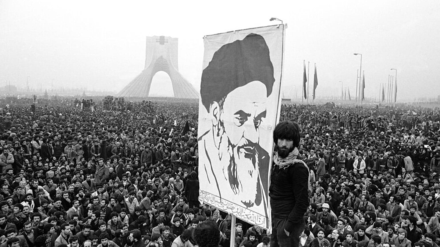 Demonstrators hold up a poster of Ayatollah Khomeini, the former supreme leader of Iran, during a protest in Tehran, 10 Dec, 1978. 