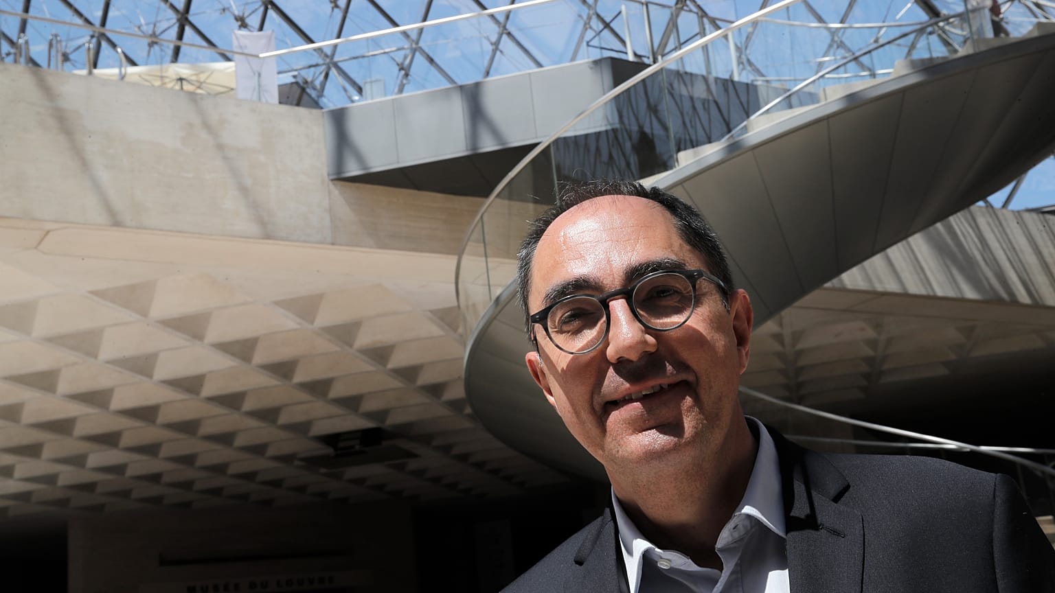 A former president of the Louvre has been indicted for money laundering