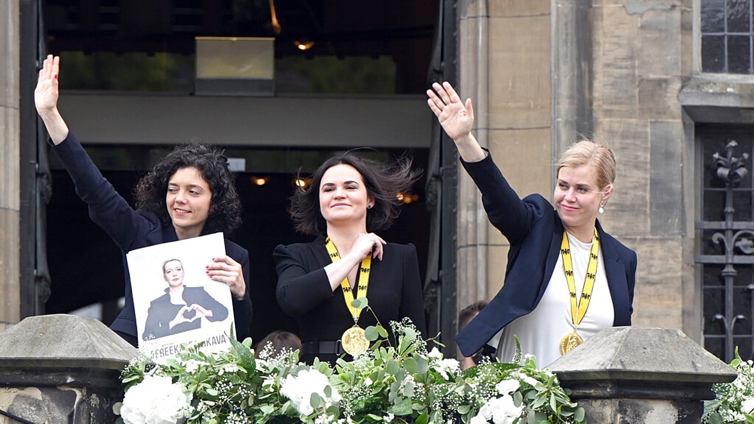 Svetlana Tikhanovskaya, center, Veronika Zepkalo, right, and the sister of Maria Kalesnikava receive the Charlemagne Prize in Aachen, Germany