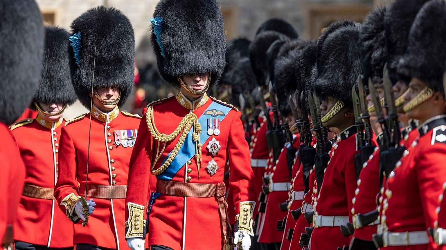 FILE - Britain's Prince William, Colonel of the Irish Guards, inspects the 1st battalion in the Quadrangle of Windsor Castle, 17 May 2022