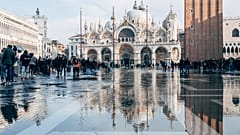 Venice’s transport, industry and tourism rely on water, but the sea is also threatening to submerge the fragile city. 