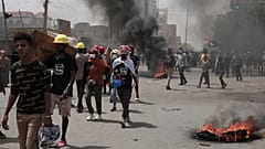 صورة أرشيفية لمتظاهرين مشاركين في مسيرة ضد الحكم العسكري في الخرطوم،  12 مايو 2022