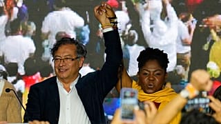 Presidential candidate Gustavo Petro, left, and his running mate Francia Marquez stand before supporters on election night in Bogota, Colombia, Sunday, May 29, 2022. 