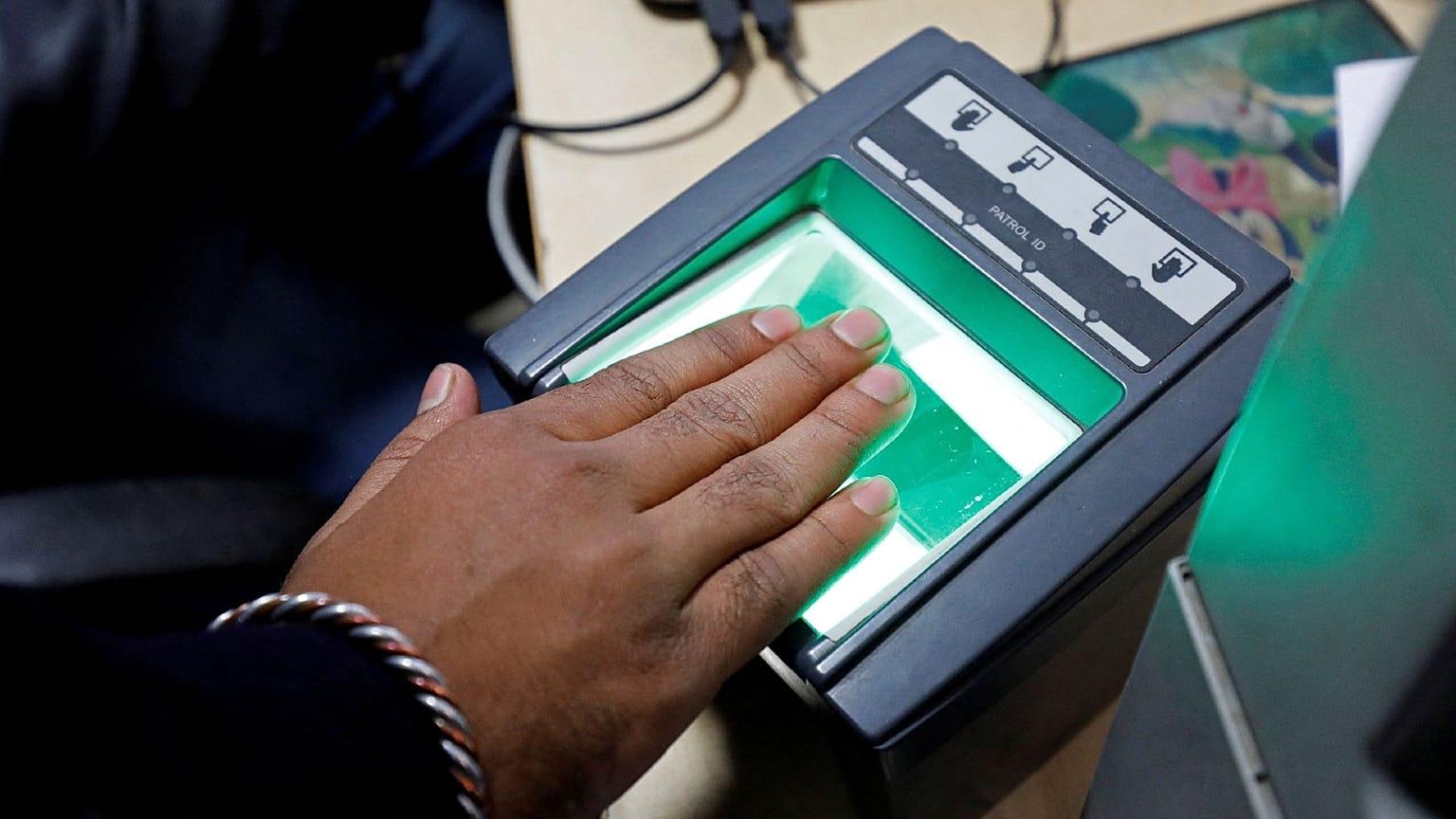 File: A woman scans her finger for the Unique Identification (UID) database system, also known as Aadhaar, at a registration centre in New Delhi, India, January 17, 2018. 