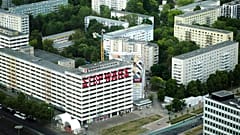 The slogan 'Stop Wars' is painted at the facade of an abandoned office building at a residencial area near the Alexanderplatz in central Berlin, Germany, Monday, May 16, 2022.