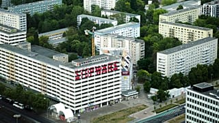 The slogan 'Stop Wars' is painted at the facade of an abandoned office building at a residencial area near the Alexanderplatz in central Berlin, Germany, Monday, May 16, 2022.