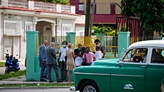 Diplomats from several countries wait outside the court building where a trial is going on for Cuban artists Luis Manuel Otero Alcantara and Maykel Castillo in Havana, Cuba, M