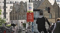 Campaign posters adorn the streets of Danish cities and towns