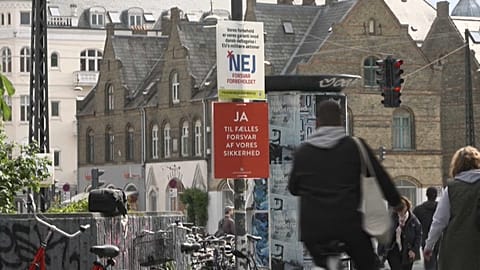 Campaign posters adorn the streets of Danish cities and towns