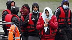 A group of people thought to be migrants are brought in to Dover, Kent, following a small boat incident in the Channel, England, Monday May 23, 2022. 