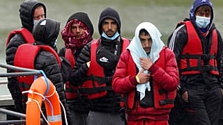 A group of people thought to be migrants are brought in to Dover, Kent, following a small boat incident in the Channel, England, Monday May 23, 2022.