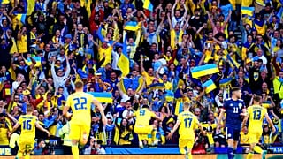 Ukraine's Roman Yaremchuk, center, celebrates after scoring his side's second goal during the World Cup 2022 qualifying play-off soccer match between Scotland and Ukraine. 