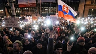 FILE- In this Friday, March 9, 2018, file picture demonstrators light the torches of their smartphones during an anti-government rally in Bratislava, Slovakia. 