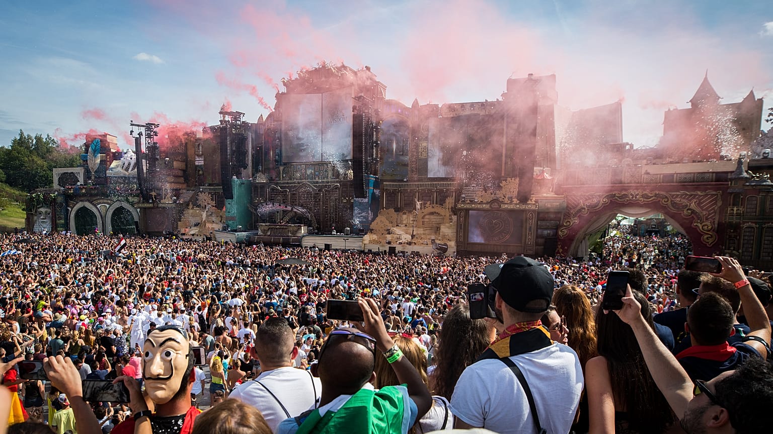Revelers gather as a DJ performs at the main stage on the first day of the Tomorrowland music festival on July 19, 2019, in Boom.