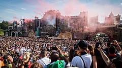 Revelers gather as a DJ performs at the main stage on the first day of the Tomorrowland music festival on July 19, 2019, in Boom.