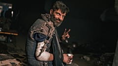 Injured fighter of the Azov regiment receives medical help in a make-shift hospital inside the Azovstal steel plant during its siege, Mariupol, Ukraine. May 2022
