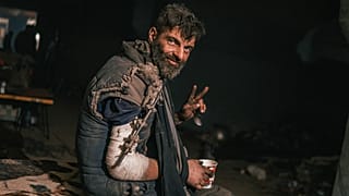 Injured fighter of the Azov regiment receives medical help in a make-shift hospital inside the Azovstal steel plant during its siege, Mariupol, Ukraine. May 2022